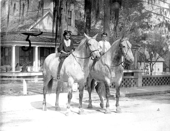 two people on horses, old historic photo